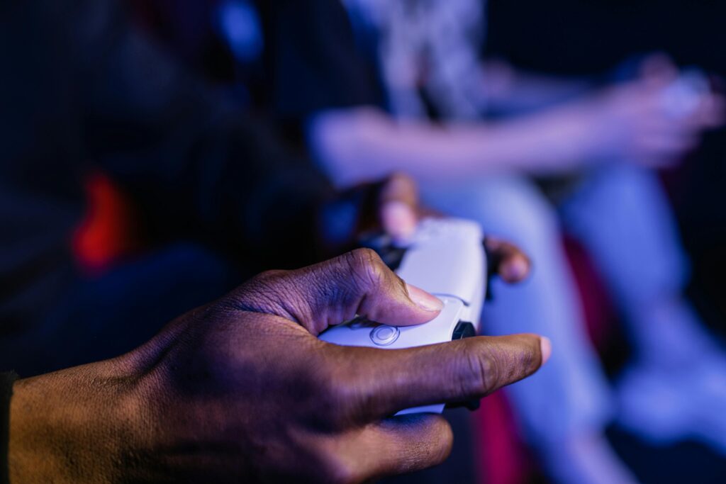 A close-up shot showing hands holding a video game controller, perfect for gaming themes.